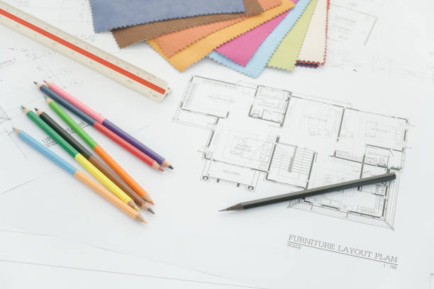 istock Architectural drawing with sample of material on working desk 876430924