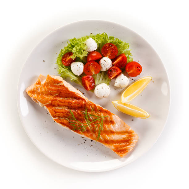 istock Fish dish - salmon steak and vegetables 876438622