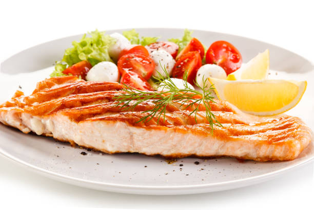 istock Fish dish - salmon steak and vegetables 876438674