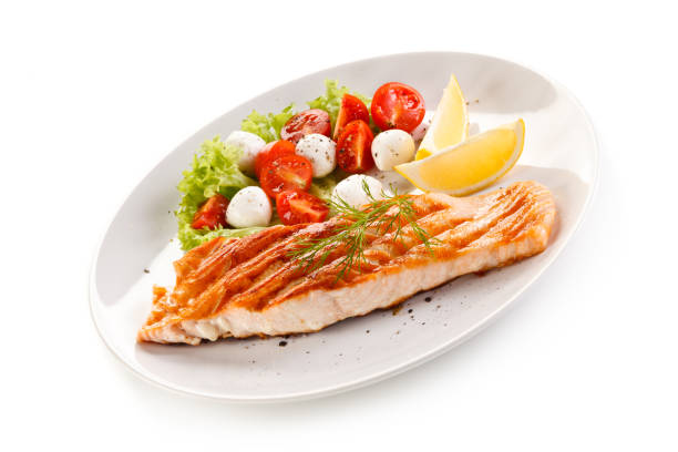 istock Fish dish - salmon steak and vegetables 876438694