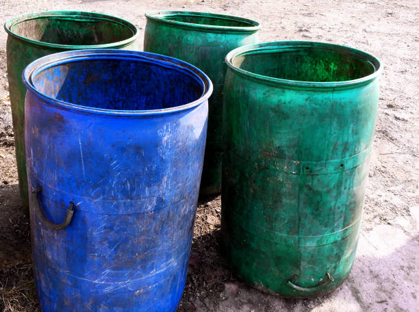 istock Group of Grungy Plastic Trash Bins 876438848
