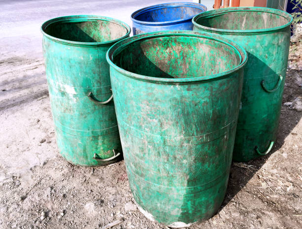 istock Group of Grungy Plastic Trash Bins 876438882