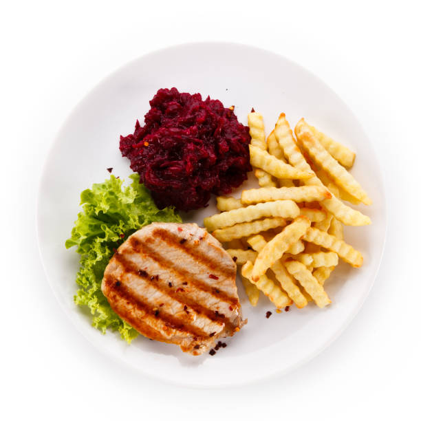 Grilled steak with French fries and vegetables