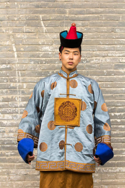 istock Young man in a traditional Mongolian outfit. 876442586