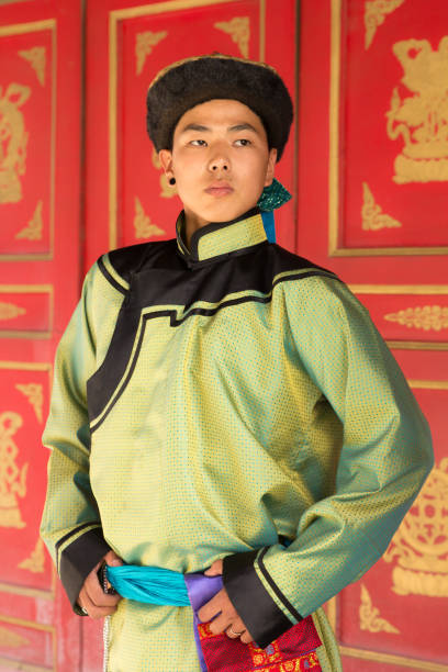 istock Young man in a traditional Mongolian outfit. 876442588