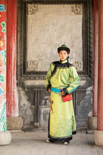 istock Young man in a traditional Mongolian outfit. 876442592