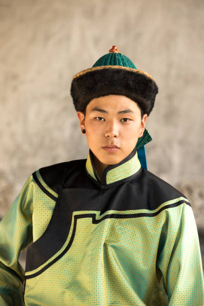istock Young man in a traditional Mongolian outfit. 876442594