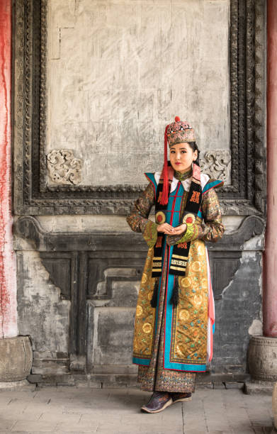 istock Young woman in a traditional Mongolian outfit. 876442668