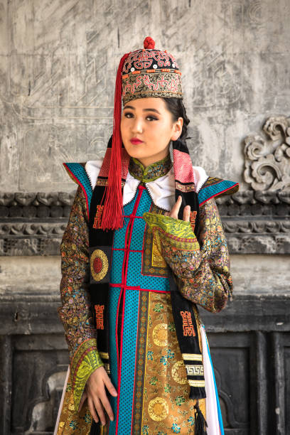 istock Young woman in a traditional Mongolian outfit. 876442676