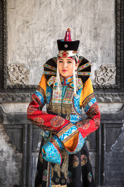 istock Young woman in a traditional Mongolian outfit. 876442690