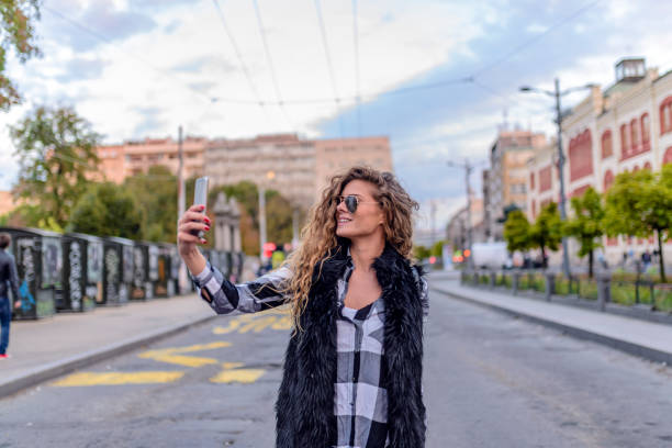 istock Young woman taking a selfie 876452270