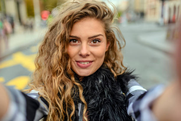 istock Young woman taking a selfie 876452276
