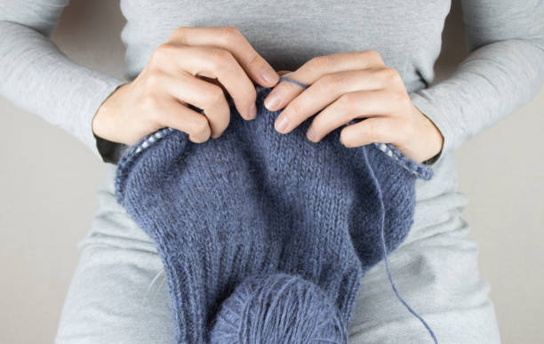 istock Woman knitting with knitting 876457052