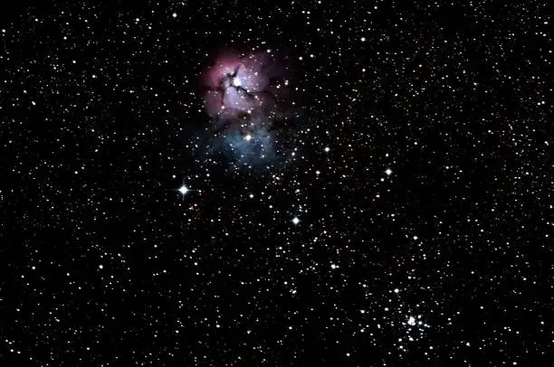 The Trifid Nebula (catalogued as Messier 20 or M20 and as NGC 6514) is an H II region located in Sagittarius. It was discovered by Charles Messier on June 5, 1764.