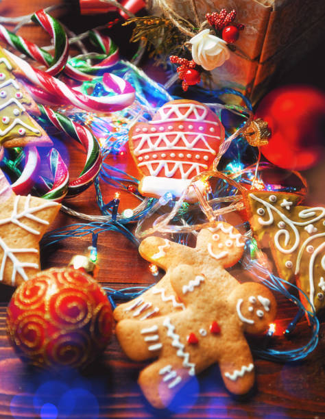 istock Christmas still life. homemade ginger biscuits, cane candy, on a wooden background. 876460562