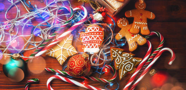istock Christmas still life. homemade ginger biscuits, cane candy, on a wooden background. 876460578