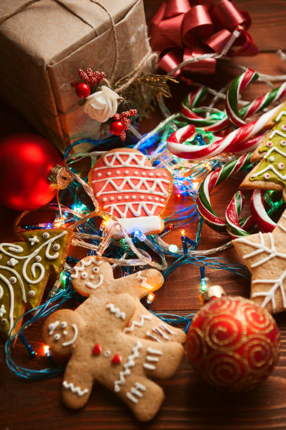 istock Christmas still life. homemade ginger biscuits, cane candy, on a wooden background. 876460802