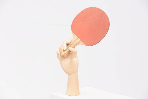 istock prosthetic hand holds Table Tennis Racket 876470188