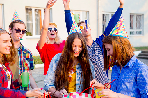 Group of teens are having a birthday party
