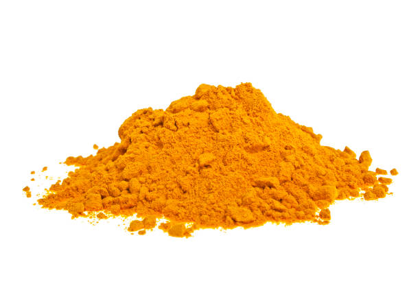 istock Pile of ground turmeric on a white background 876478348