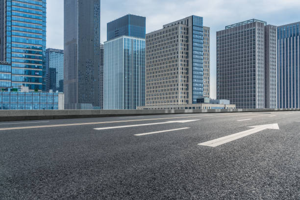 istock Empty road front of modern buildings 876478958