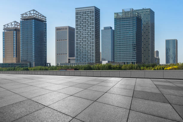 istock Empty pavement front of modern office buildings 876481572