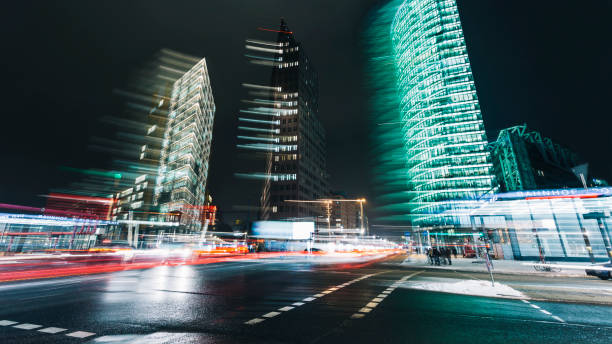 istock Potsdamer Platz with abstract light trails at night, Berlin, Germany 876485080