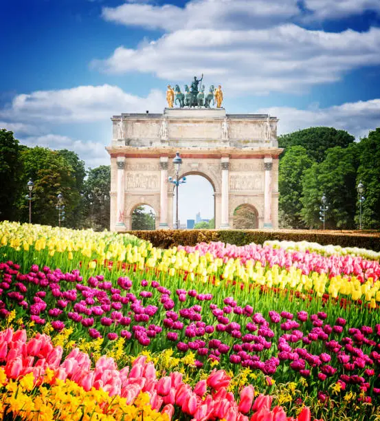 Arc de Triomphe du Carrousel in Tuileries Garden at sunny spring day, Paris, France, retro toned