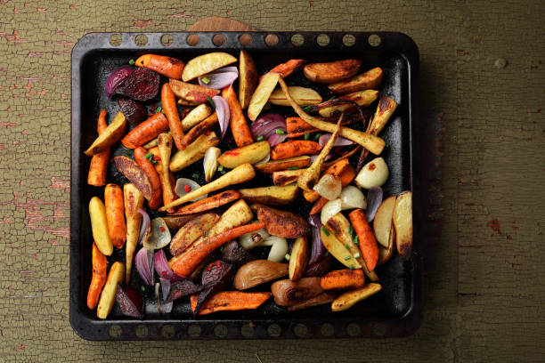 istock Roasted vegetables mix on baking tray, food above 876485674