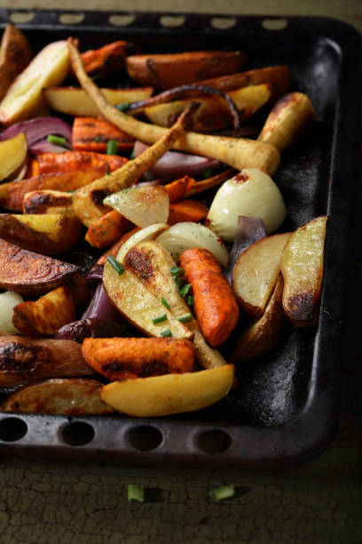 istock Roasted vegetables mix on tray, food closeup 876485676