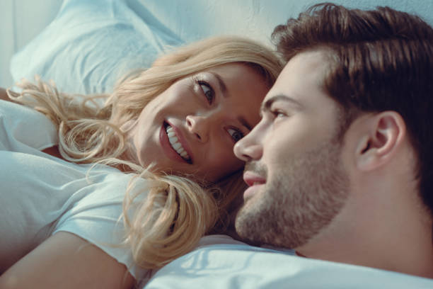 istock couple relaxing in bed at morning 876486834