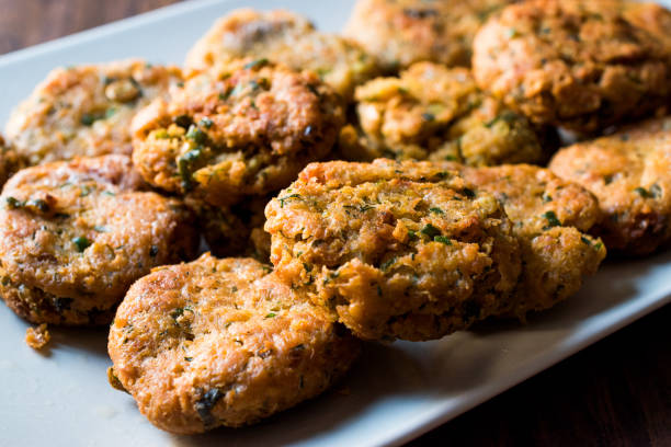 istock Fried Chickpeas Falafel on wooden surface. 876487048