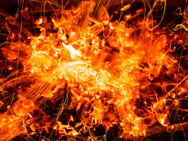istock abstract background of burning coals of fire with sparks 876489912