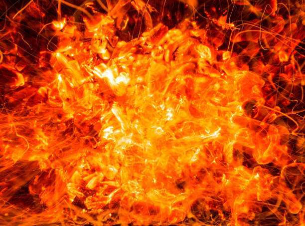 istock abstract background of burning coals of fire with sparks 876490268