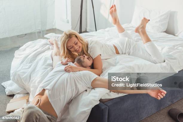 Couple Cuddling In Bed Stock Photo - Download Image Now - Adult, Affectionate, Beautiful People
