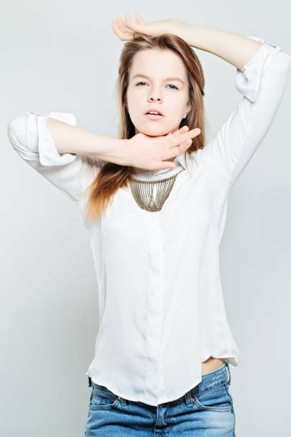 istock Beautiful Young Woman Posing on Background 876493272