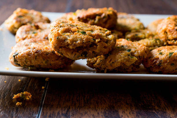istock Fried Chickpeas Falafel on wooden surface. 876497922