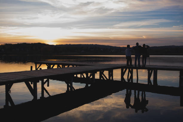 istock Family on lake pier 876502876