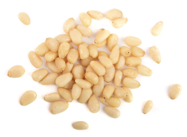 istock Shelled cedar pine nuts isolated on white background. top view 876503110