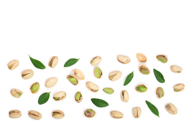 istock Pistachios isolated on white background with copy space for your text, top view. Flat lay pattern 876504290