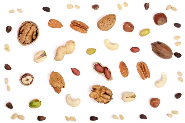 istock mix of different nuts isolated on white background, Flat lay pattern, Top view 876504450