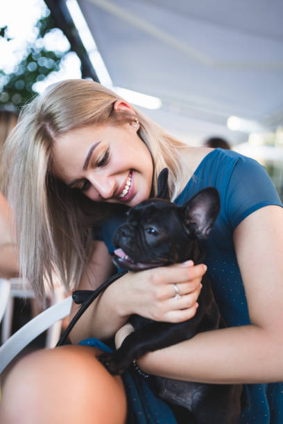istock Woman with dog in cafe 876504638