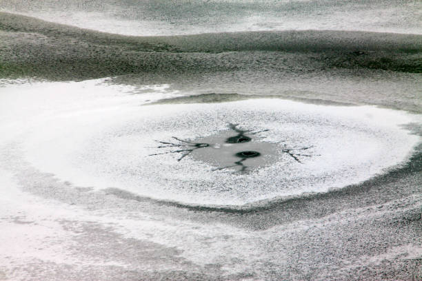 istock cracked ice on river in winter, China 876505324