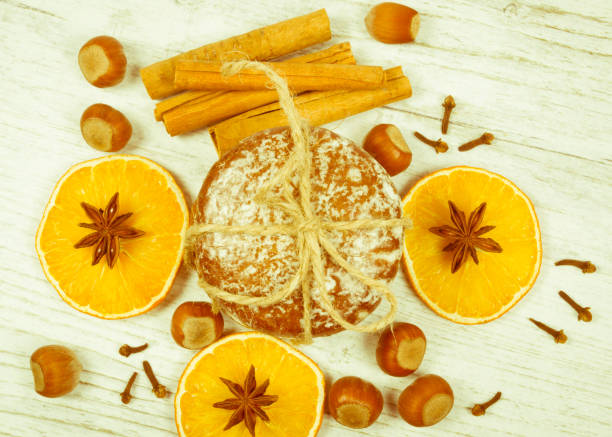 istock Gingerbread cookies, cinnamon and orange slices. Christmas decoration. 876516100