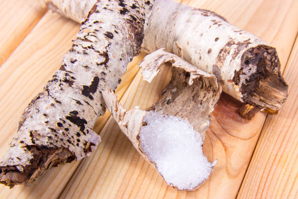 istock Xylitol - sugar substitute. Birch sugar on wooden background. 876516350