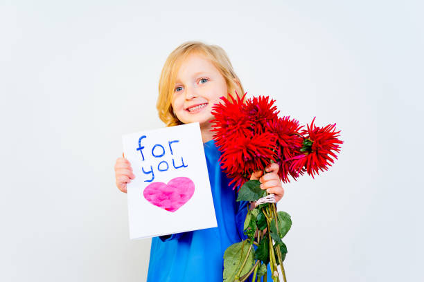 istock Girl with valentine postcard 876518756