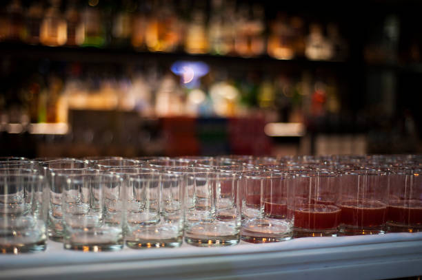 istock Empty glasses ware and ready mixed red beverage on table in the party 876518776