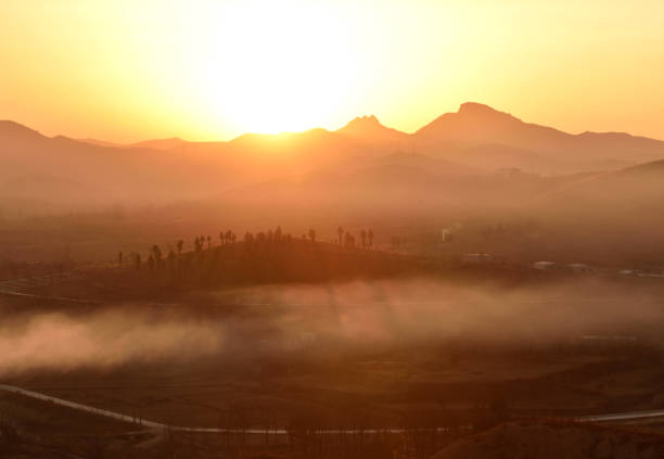 The Chinese countryside was scattered with smoke from kitchen chimneys