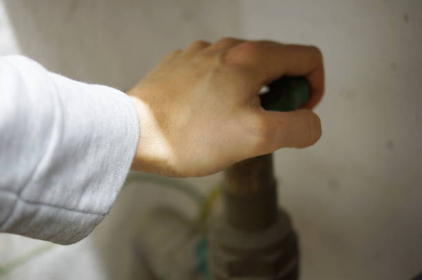 istock Close the faucet indoor 876521738
