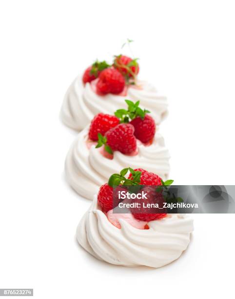 Mini Pavlova Meringue Nests With Berries And Mint On Isolated On White Stock Photo - Download Image Now